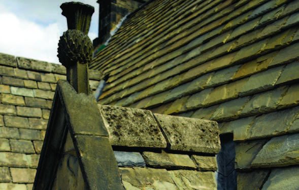 A thistle roof finial above one of Acheson house's dormer window. 