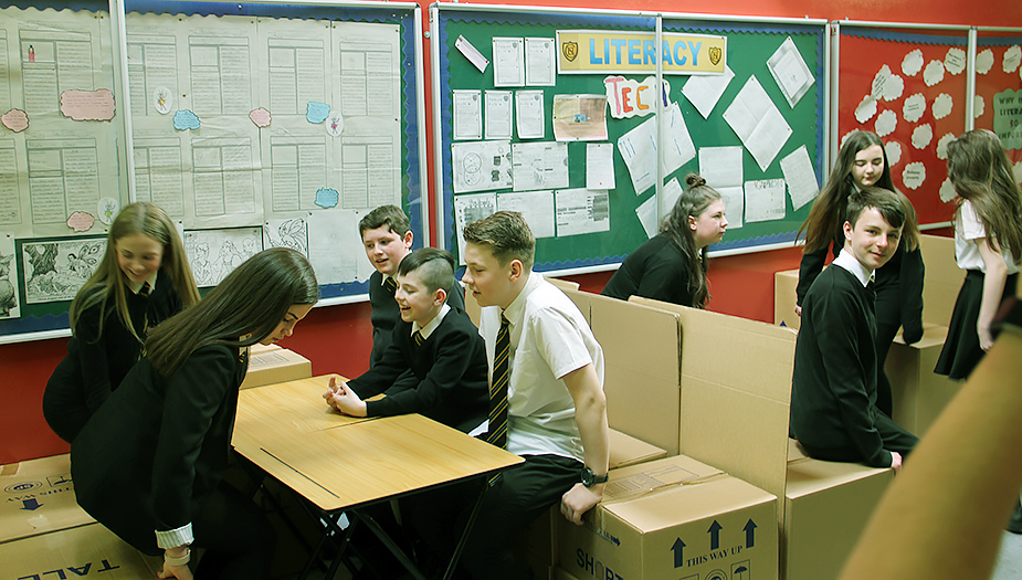 Pupils test their collaboration desks during the Tests of Change process at Clydebank Primary.