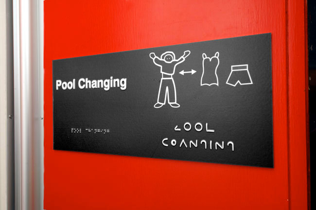 An accessible pictorial sign to pool changing facilities.