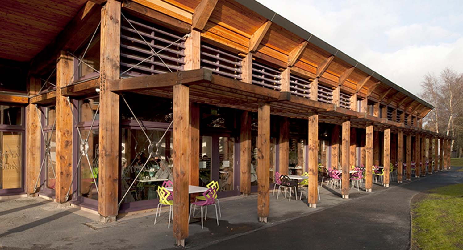 The outdoor seating area at the Robert Burns Birthplace Museum café is covered by a timber canopy.