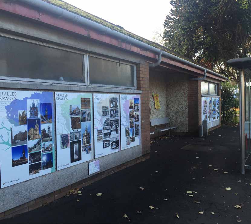 A row of posters at the entrance of a former public toilet at Robertson Park for a Stalled Spaces Project by Renfrewshire Development trust. 
