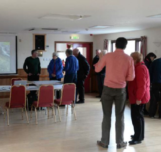 A group of people talking in a room during a Place Standard workshop in the Shetland Islands.