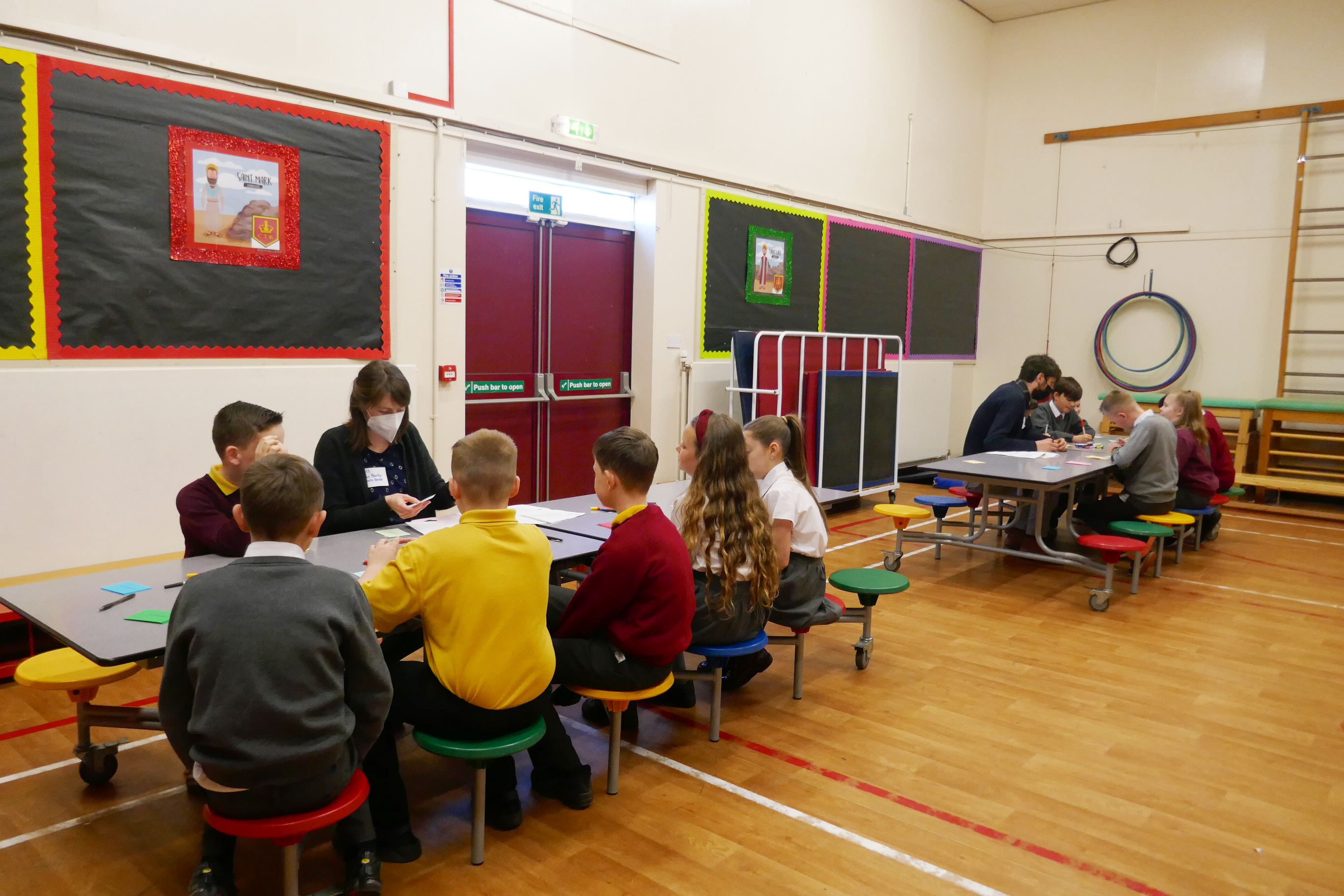 Pupils from Holytown sat in a multi-purpose hall with teachers whilst doing a Climate Action Towns workshop