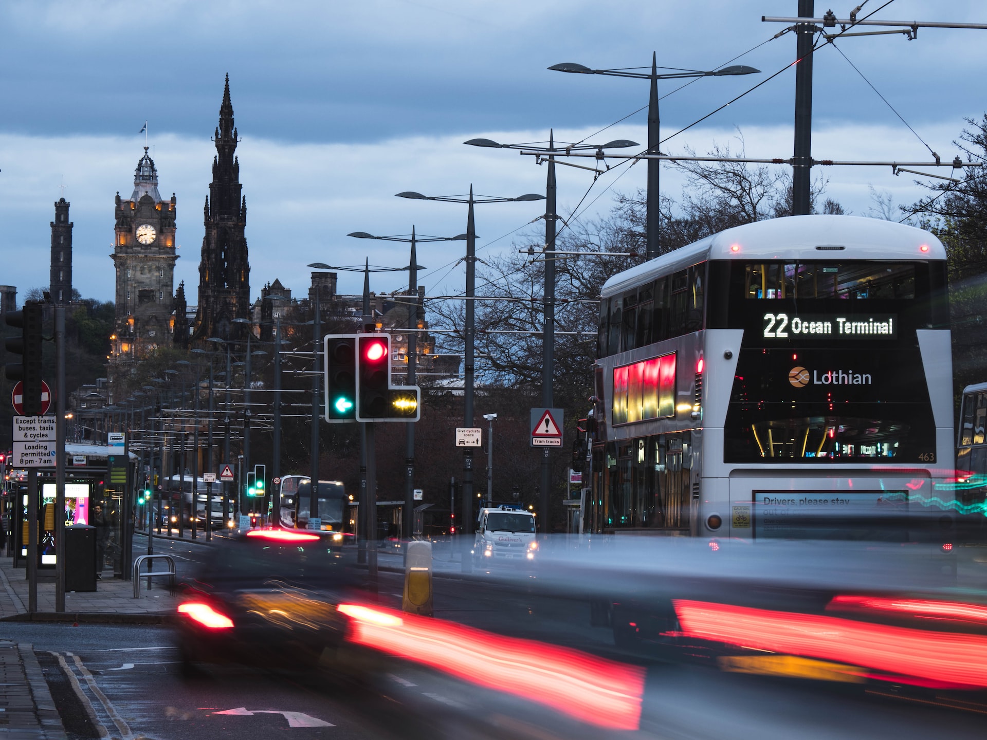 The flow of traffic on Princess Street, Edinburgh, in the evening light.