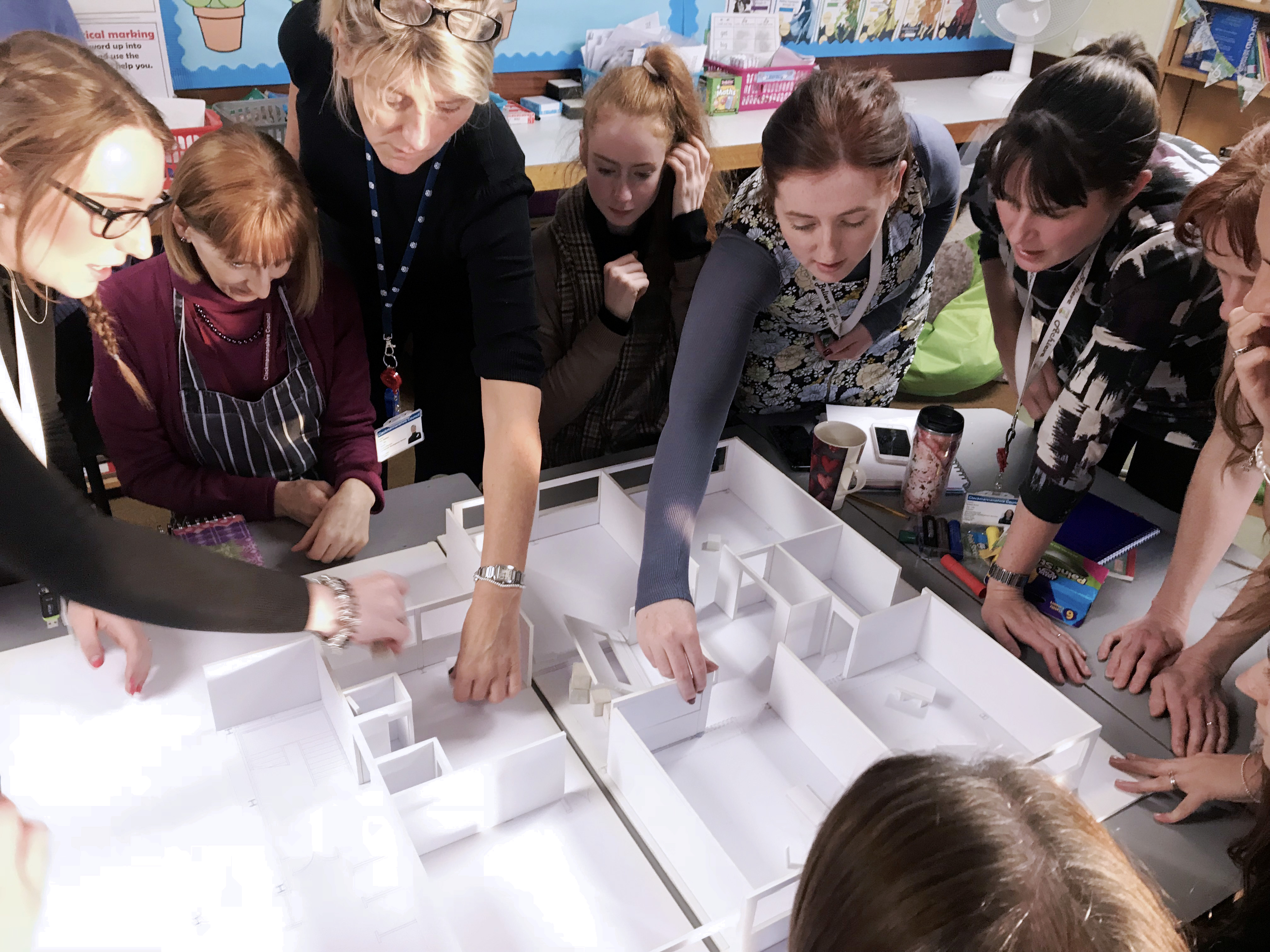 Pupils and teacher work together to create 3D models in class.