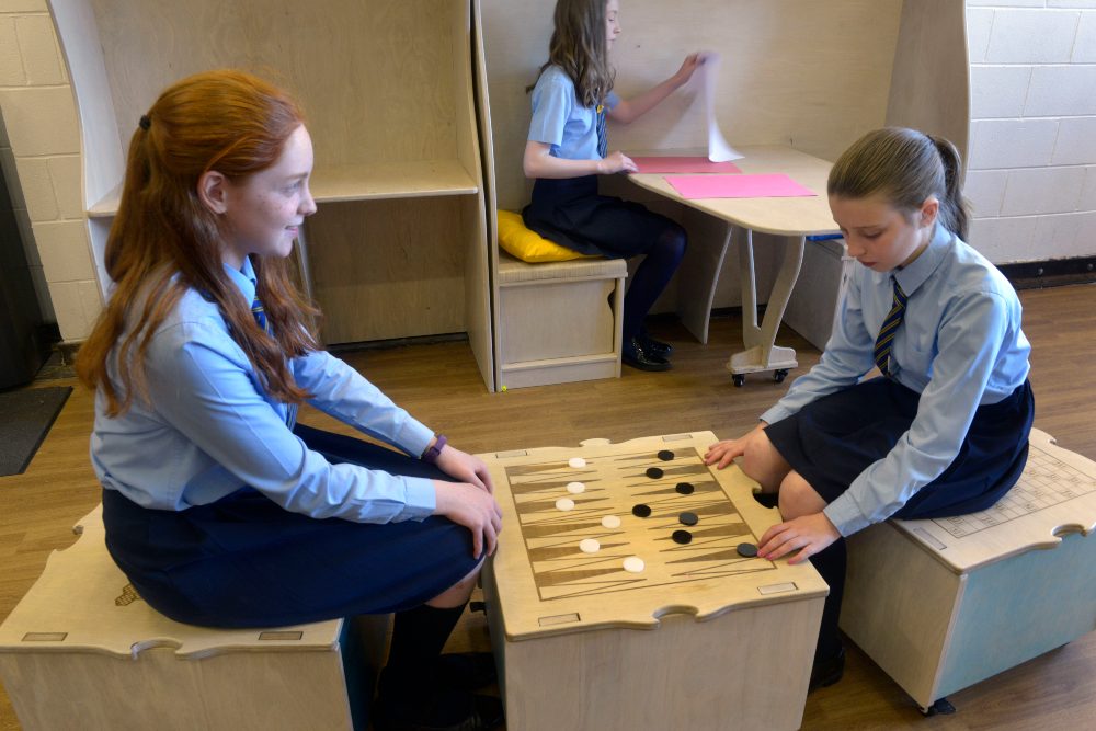 Pupils playing draughts