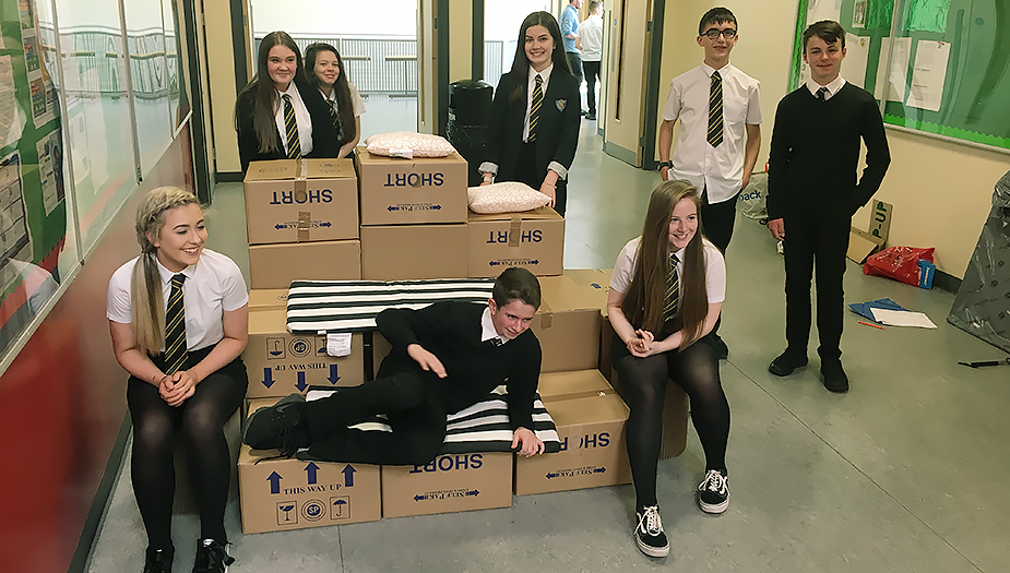 Pupils at Clydebank Primary take a group photo with their prototype seating area.