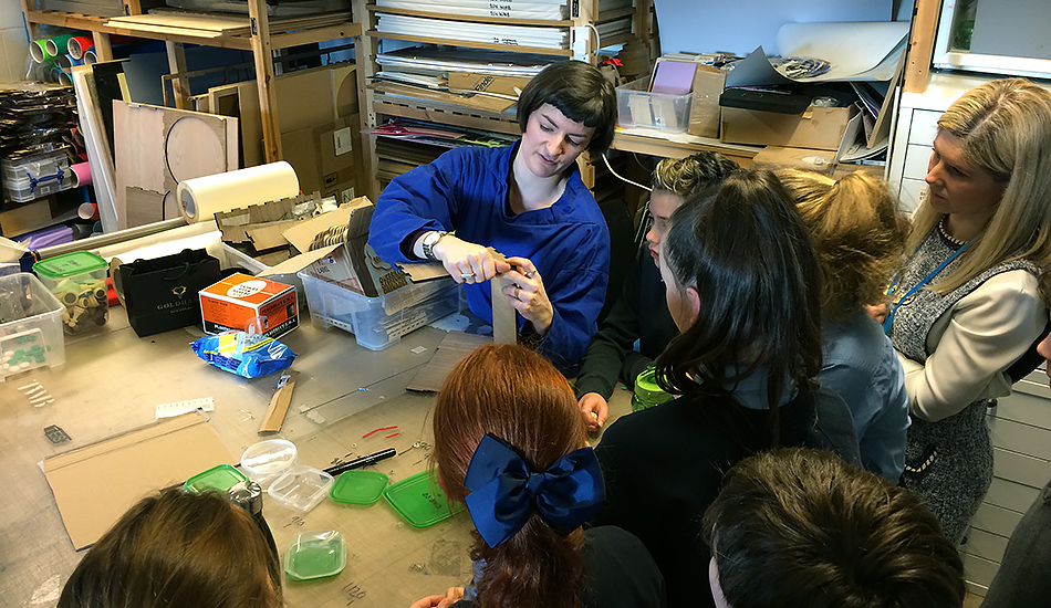 Pupils and a designer creating prototype furniture during the Tests of Change process at the Lady of the Missions Primary.