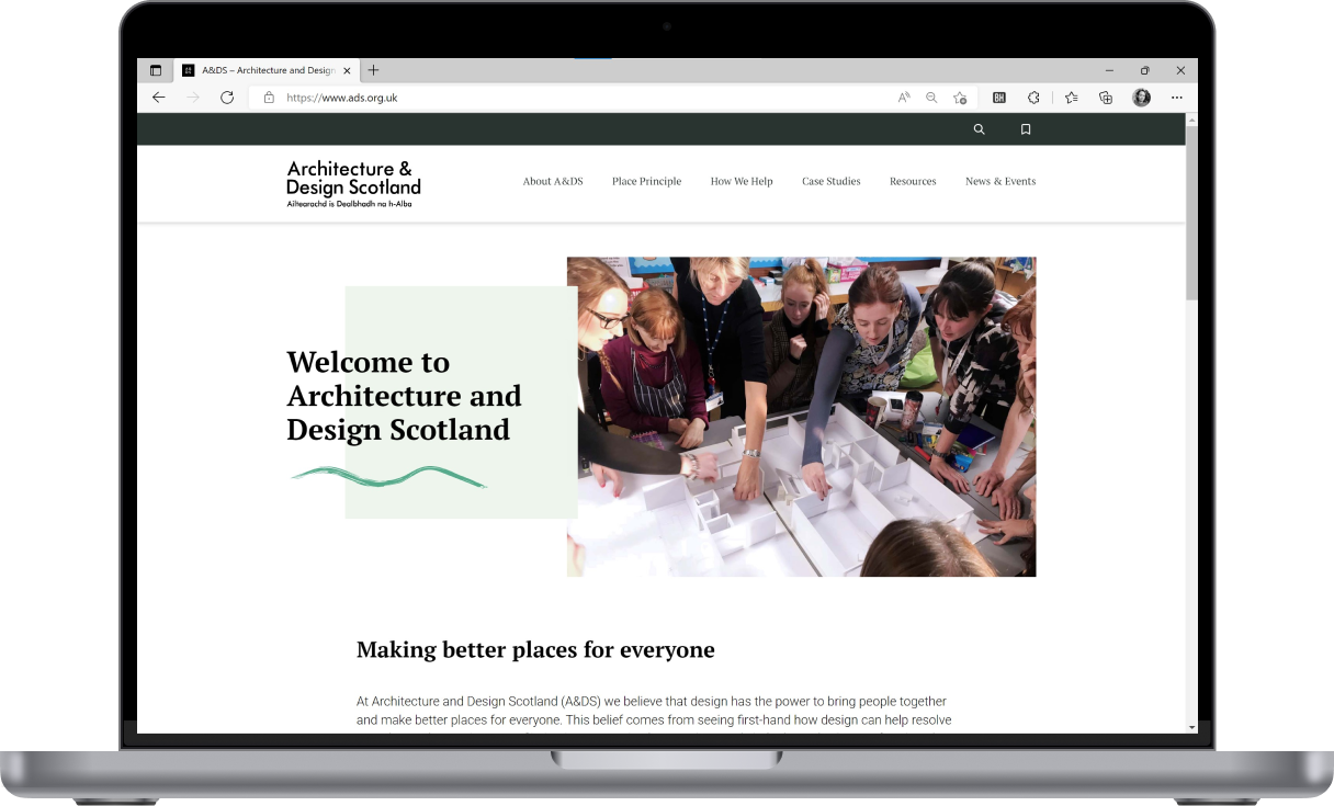 A laptop with the Architecture and Design Scotland website opened on the screen.
