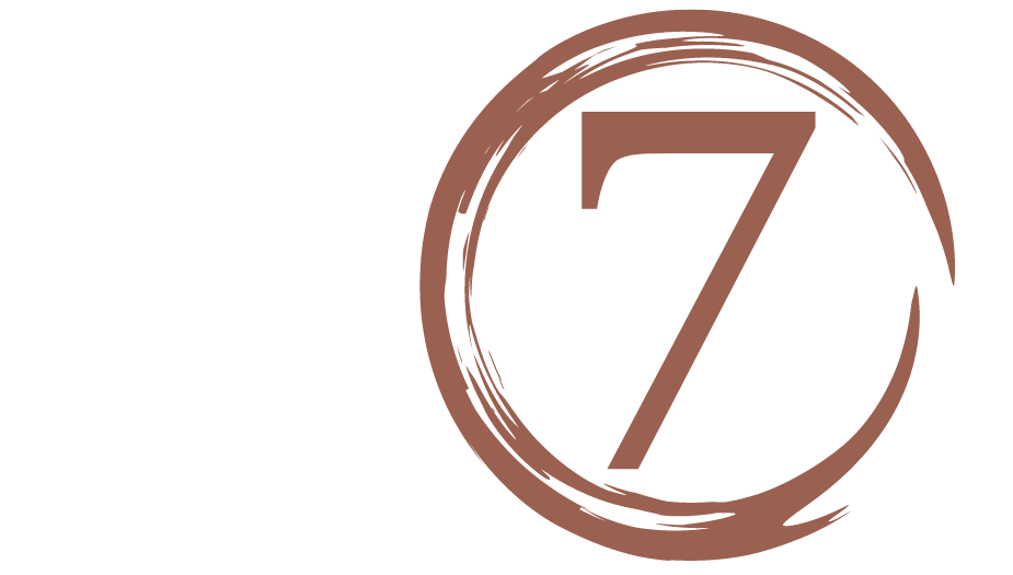 The number 7 in a brown circle.
