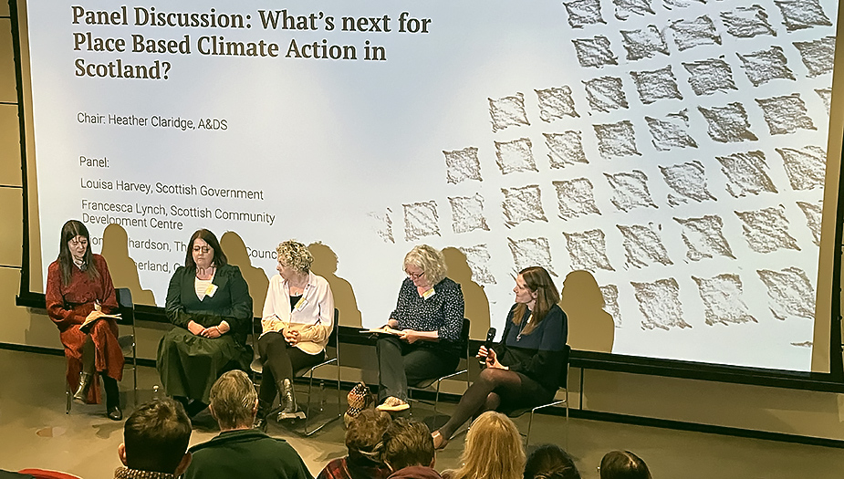 A group of women sat on chairs during the panel session at the Climate Action Towns Gathering and resource launch.