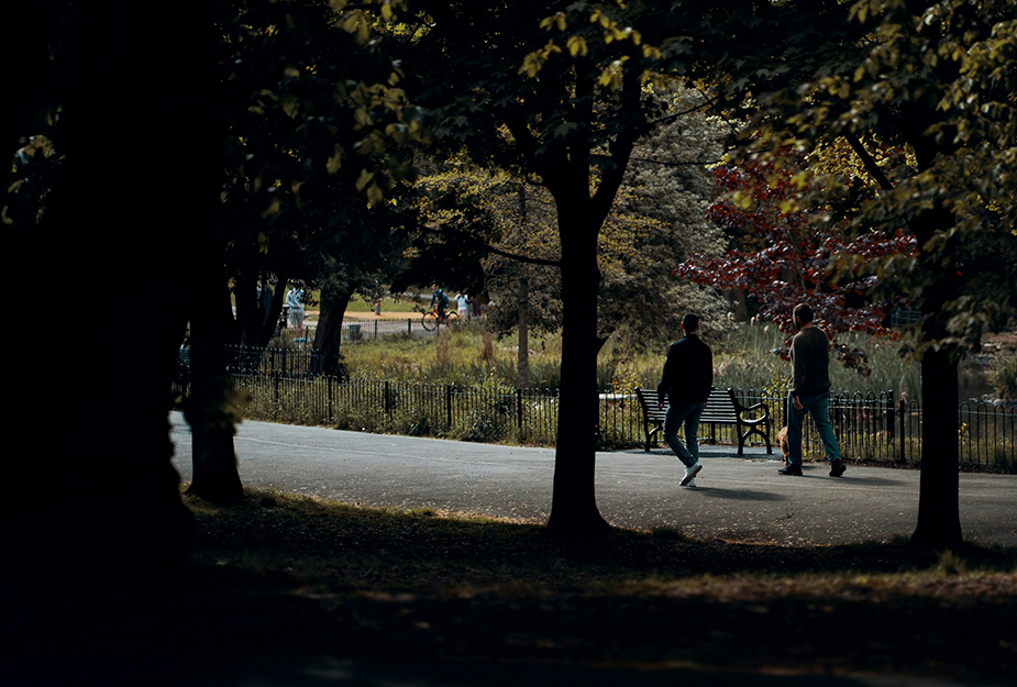 People walking their dog at Kelvingrove Park in Glasgow.