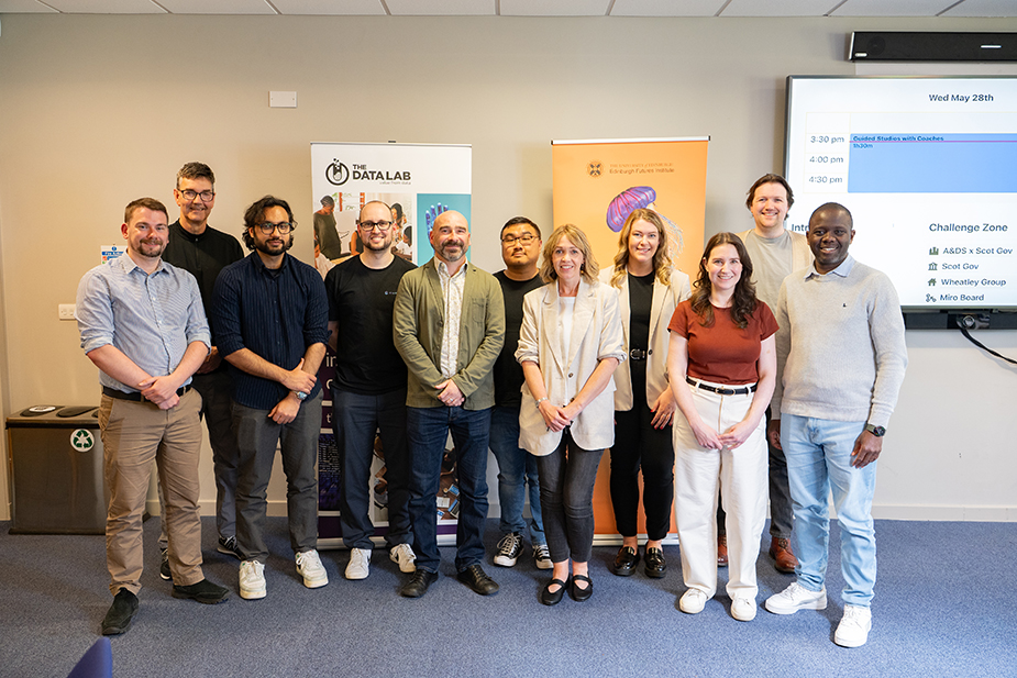 Mentors for the Data Lab Innovation Challenge 2025 posting in front of a camera.