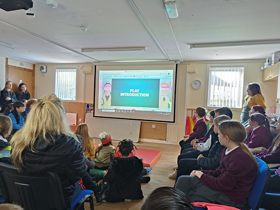 Pupils sat down listening to a presentation by West Lothian Council.