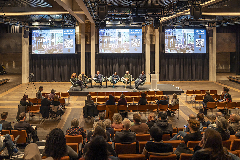 Edinburgh Futures Insitute event space with a panel of speakers and members of the public at the Ai in the City Public Forum.