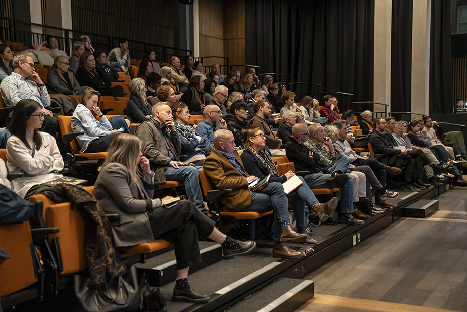 Event attendees listening to speakers at the AI in the City event in the Edinburgh Futures Institute event space.