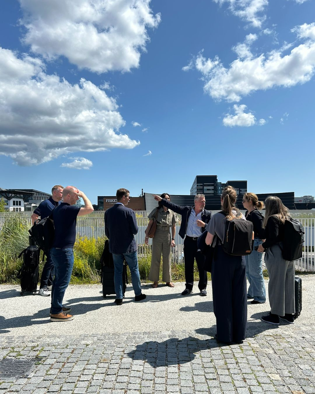 Photo of people gathered looking at the built environment of Copenhagen