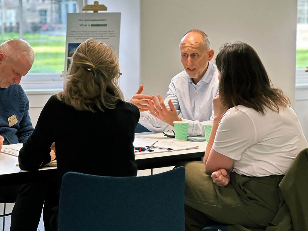 Dr Roddy Yarr speaks to his group table participants during Architecture and Design Scotland's Climate Clinic.